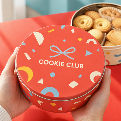 AI-generated concept image of a branded round cookie tin held for gift presentation