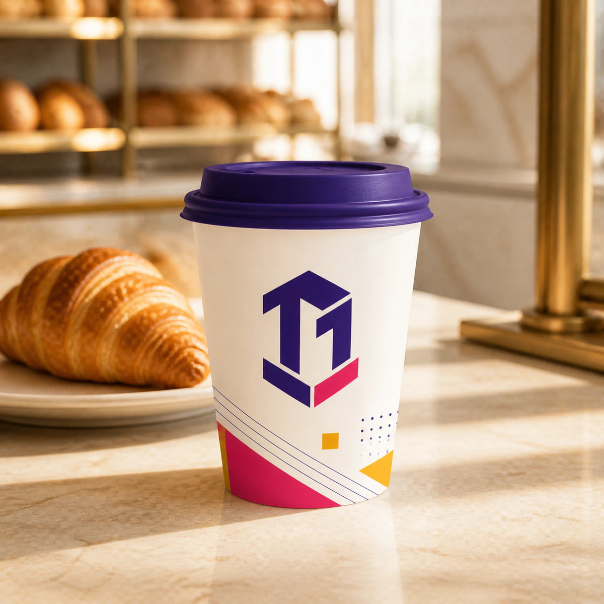 Illustrative mockup of a custom printed double wall coffee cup at a bakery counter